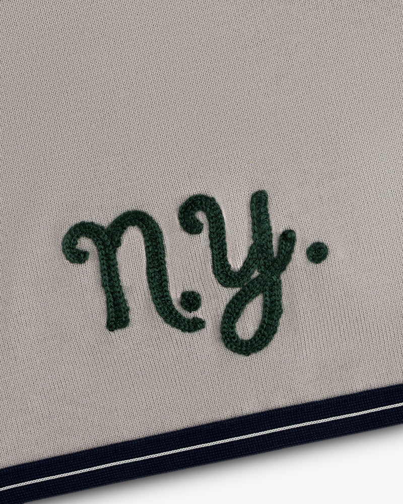 Mulberry Chainstitch Baseball Jersey: Green “ny.” on beige, navy/white striped border at bottom.