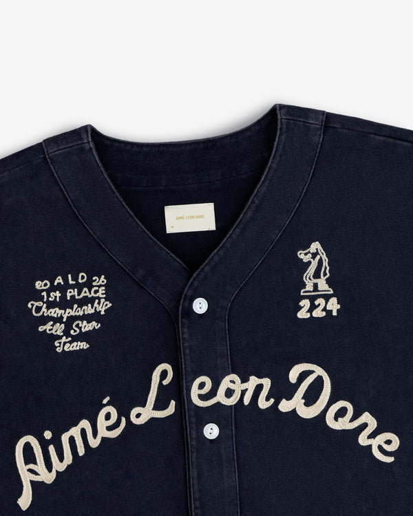 Close-up of a Mulberry Chainstitch Baseball Jersey with cream embroidery and button details.