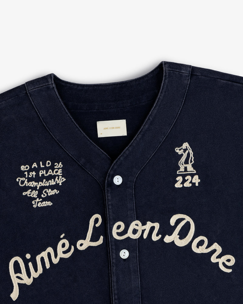 Close-up of a Mulberry Chainstitch Baseball Jersey with cream embroidery and button details.
