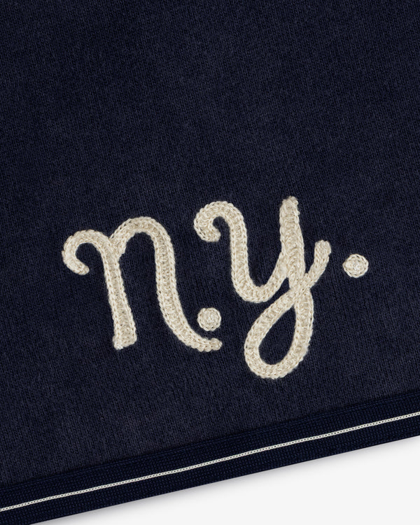 Mulberry Chainstitch Baseball Jersey in navy with cream “n.y.” embroidery and a slim bottom stripe.