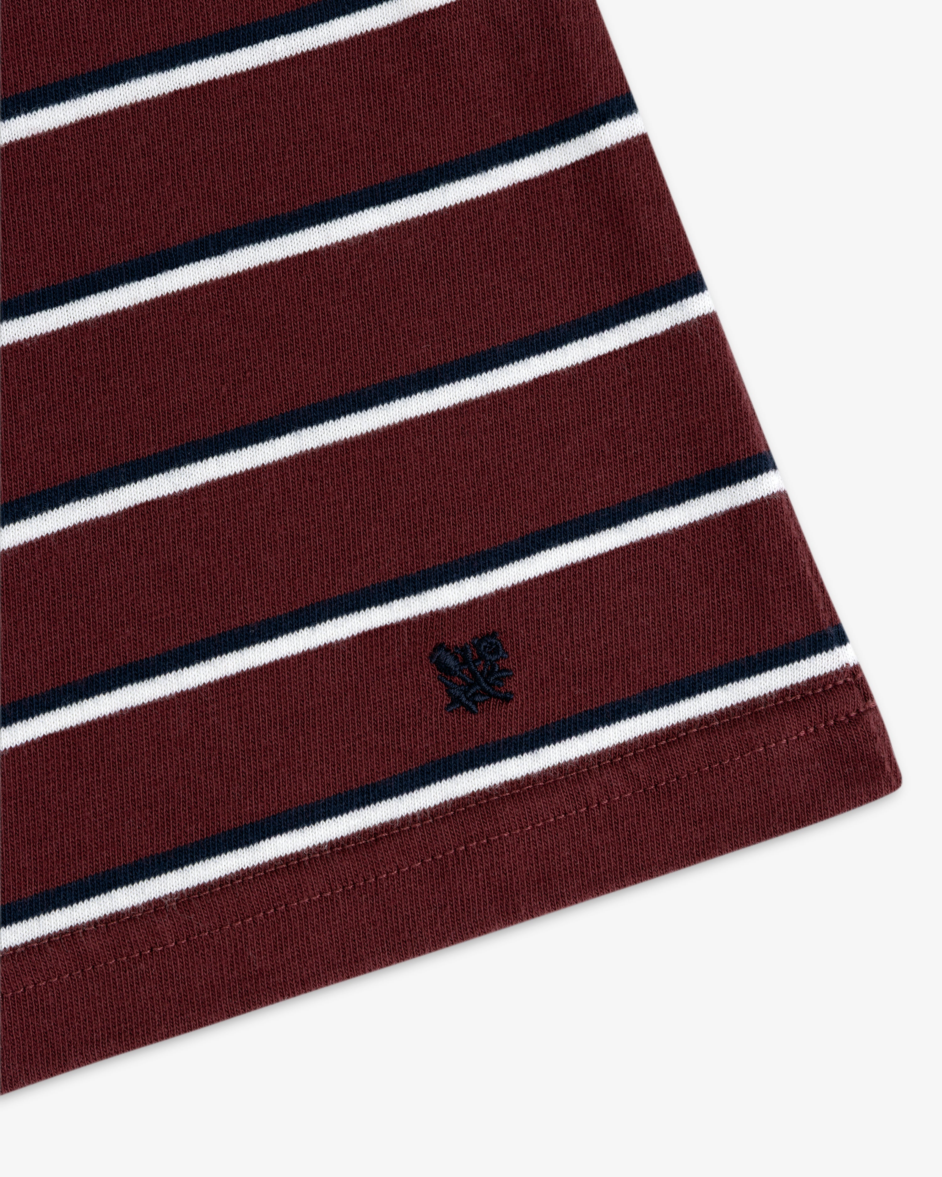 Yarn Dyed Striped Tee: Maroon with white and black stripes, plus a small black embroidered logo near the hem.