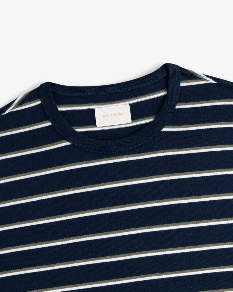 Yarn Dyed Striped Tee in navy with white and light gray stripes, shown from collar and upper chest.