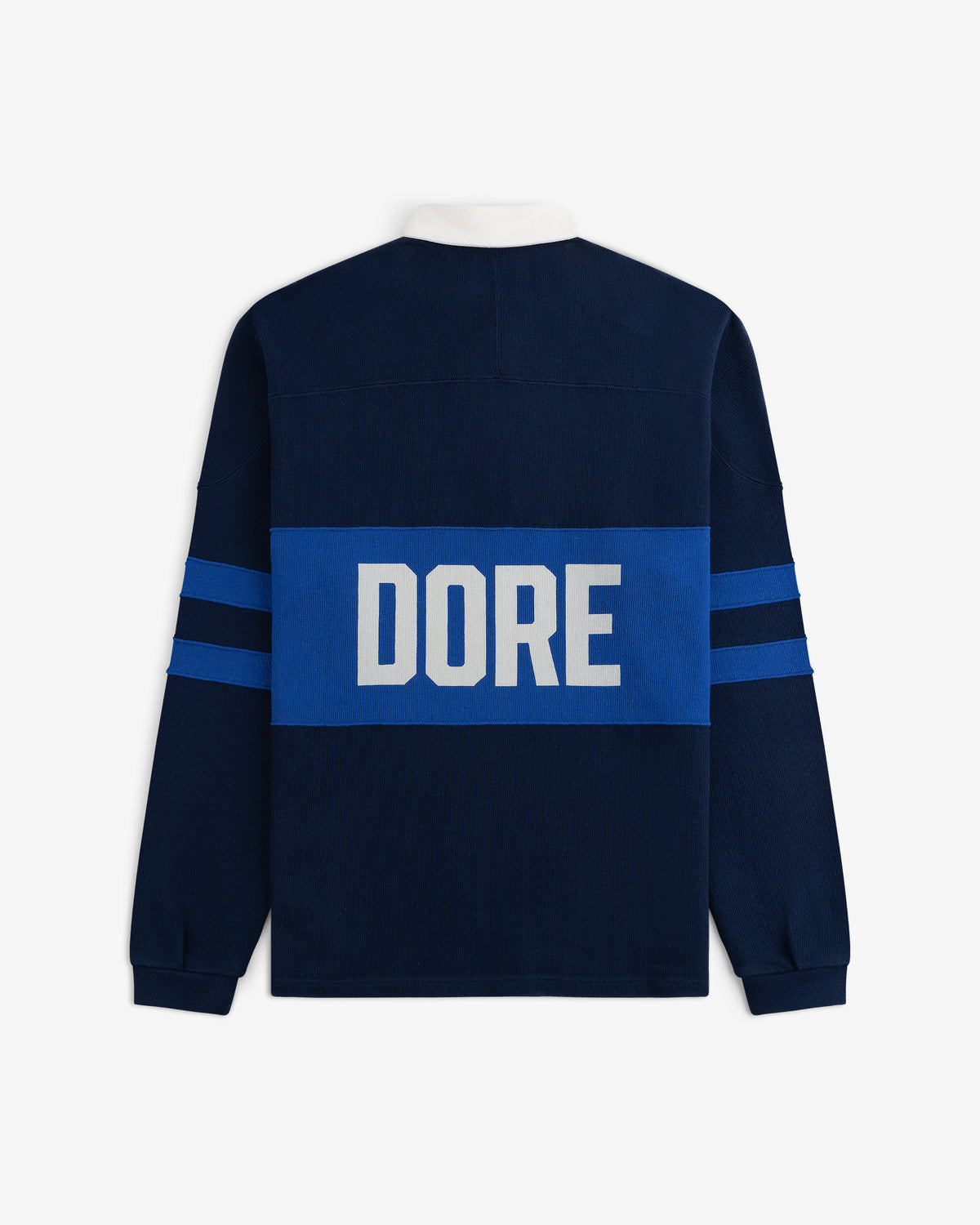 Leon Dore Collegiate Rugby: Navy long-sleeve shirt with blue stripes & “DORE” in large white letters on the back.