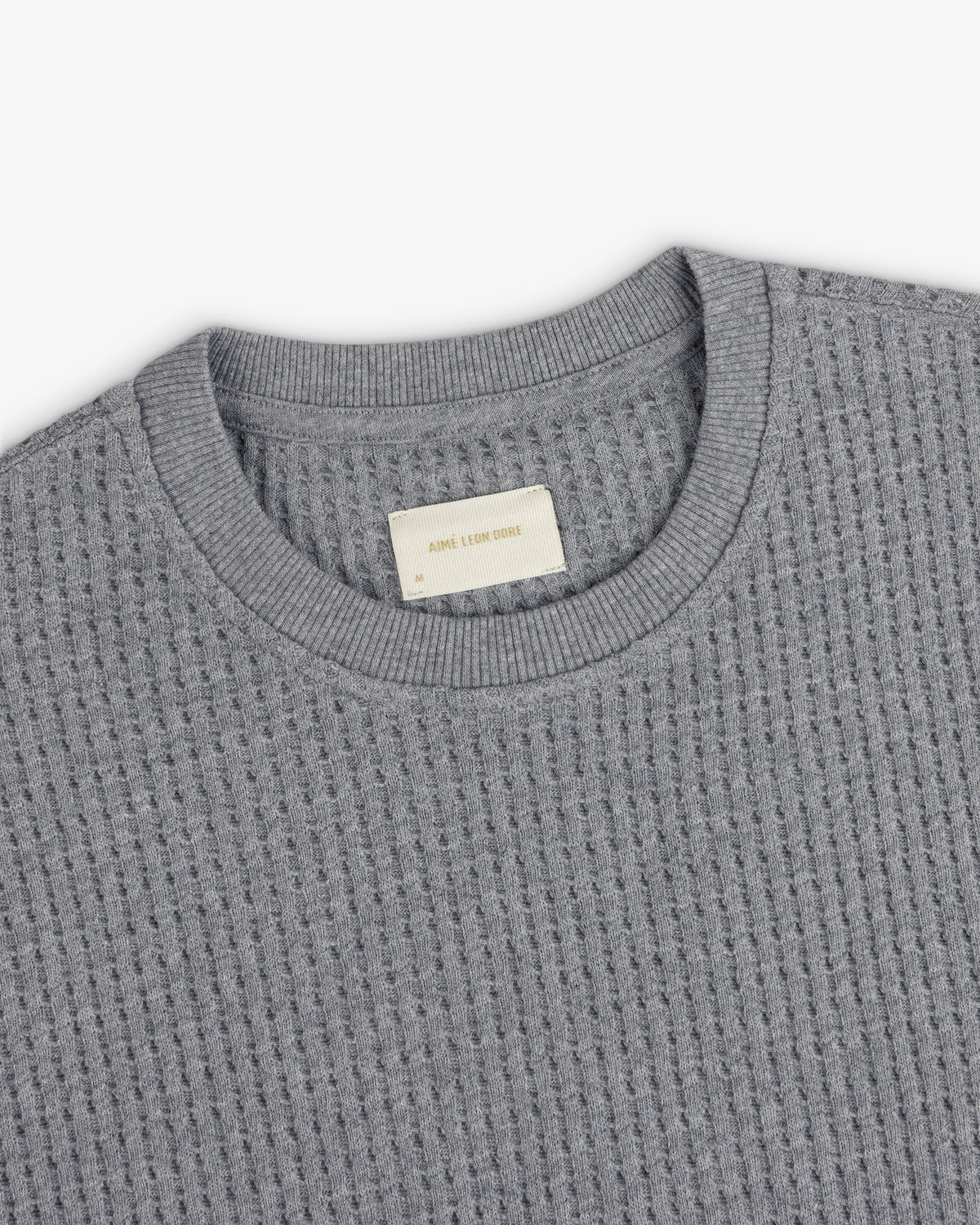 Grey Long-Sleeve Waffle Thermal shirt with a waffle-knit texture and a ribbed crew neckline.