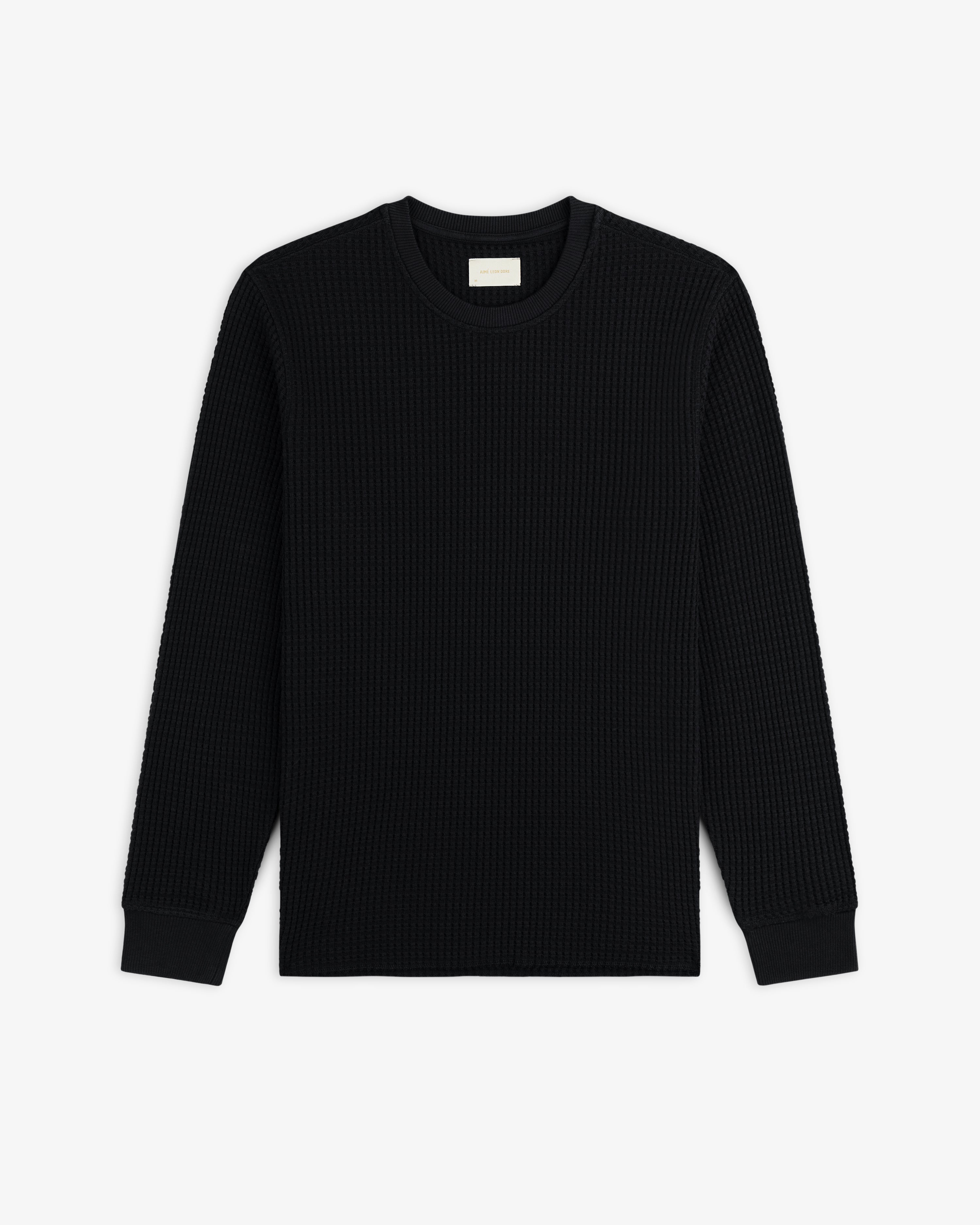 Black Long-Sleeve Waffle Thermal crewneck shirt with a waffle-knit texture.