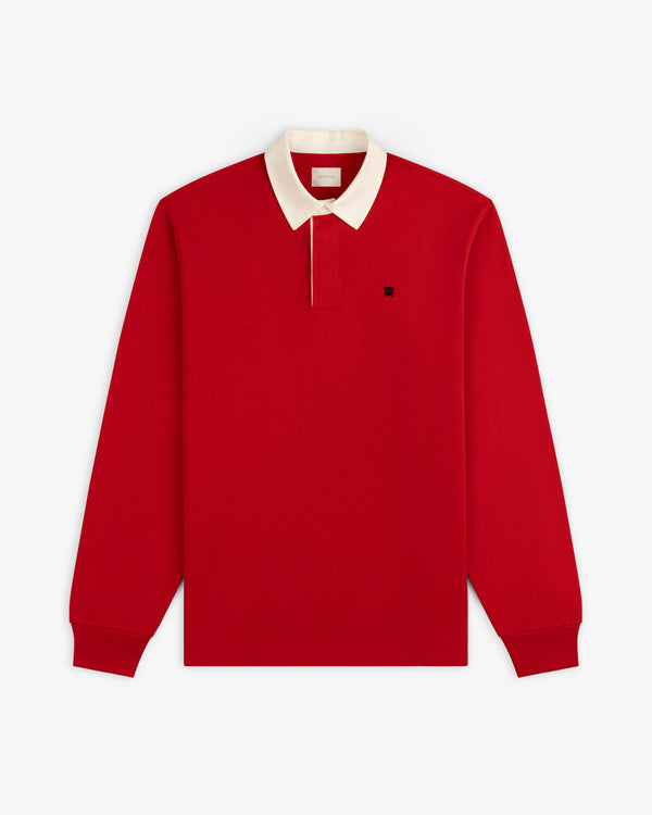 Crest Rugby: Red long-sleeve polo with white collar, front button, and small dark left-chest logo.