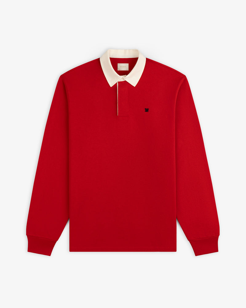 Crest Rugby: Red long-sleeve polo with white collar, front button, and small dark left-chest logo.
