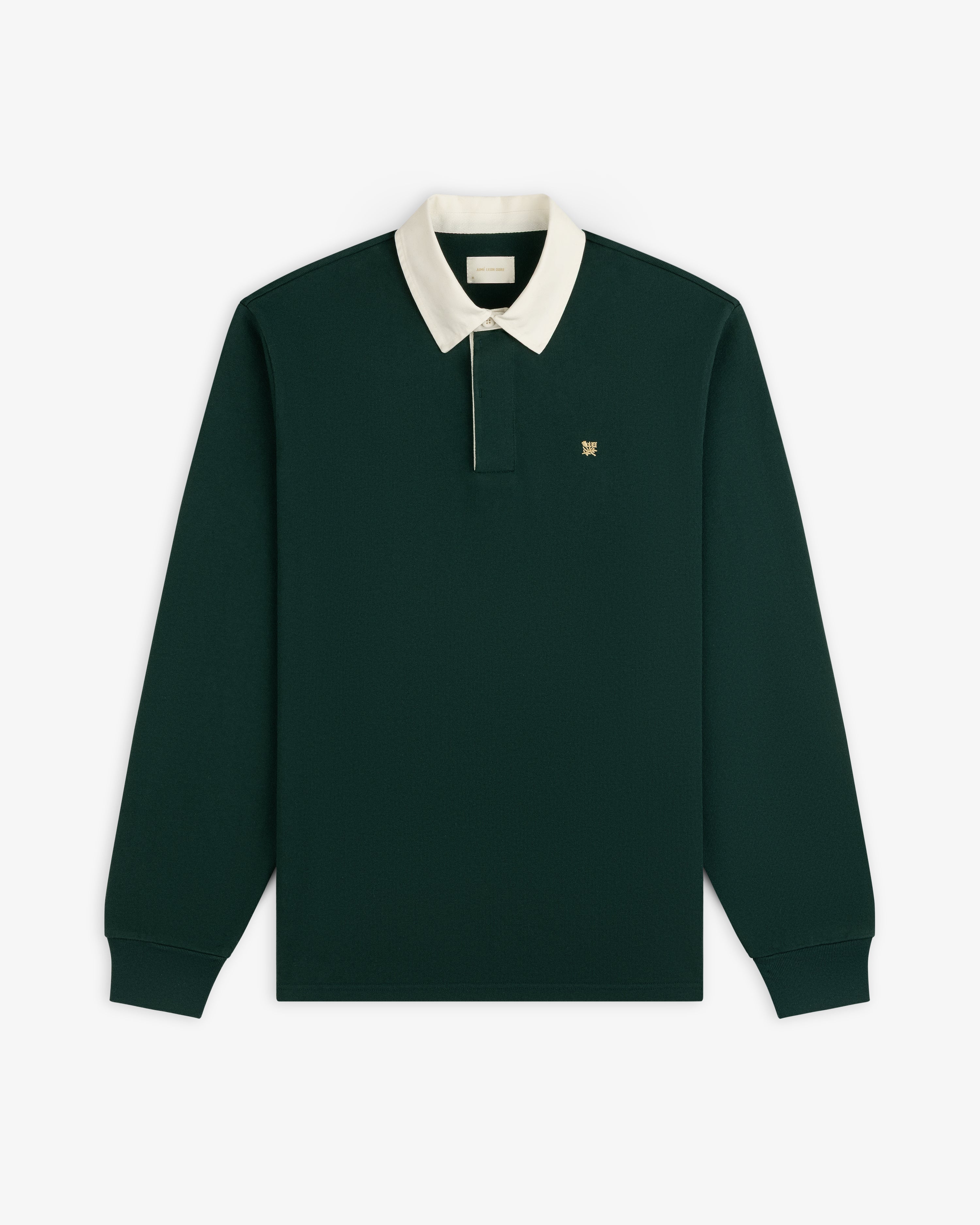 Crest Rugby: Dark green long-sleeve polo with white collar and small chest logo.