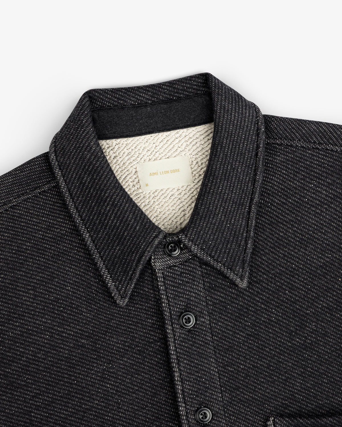 Black Terry Lounge long-sleeve shirt with a pointed collar, button front, and a textured white lining.