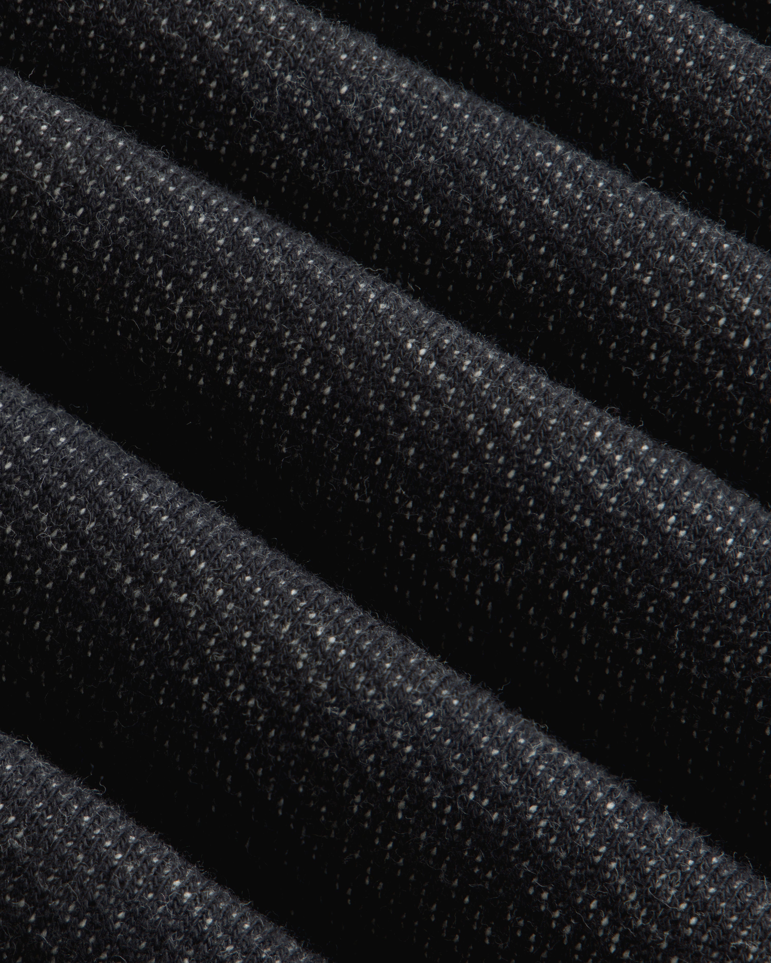 Close-up of the dark gray Terry Lounge Sweatpant featuring folded fabric with a textured, speckled weave.