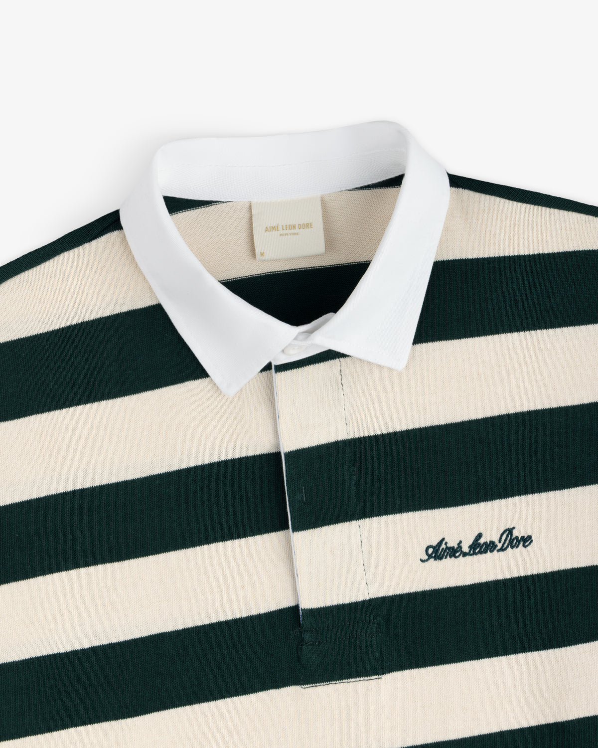 Striped Script Rugby shirt in dark green and cream with a white collar and an embroidered script logo on the chest.