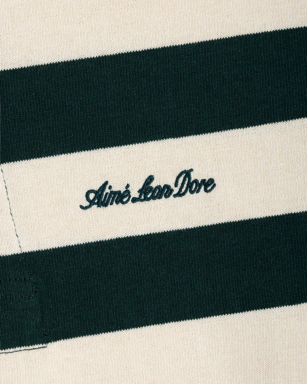 Close-up of a Striped Script Rugby shirt in dark green and off-white with the brand name embroidered in script.