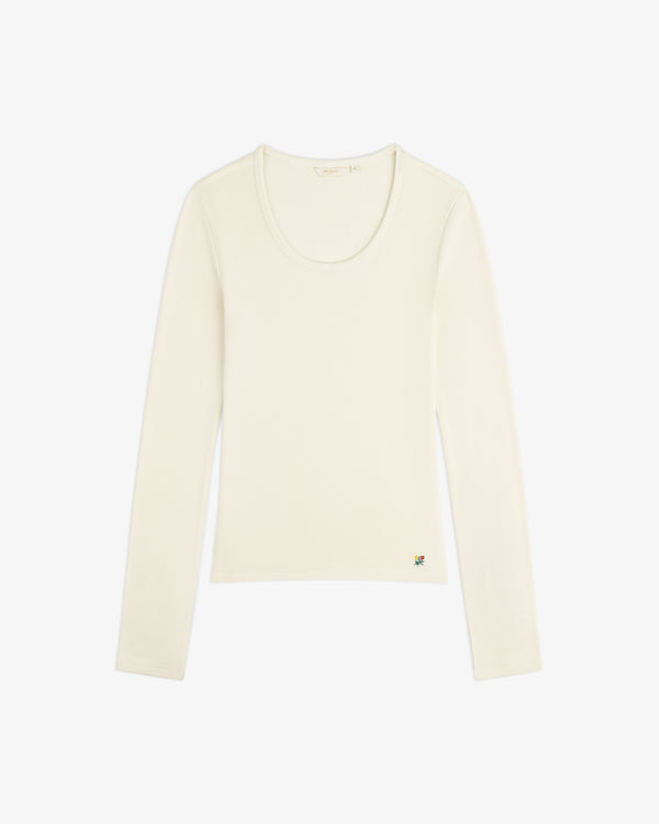 Cream-colored Ribbed Scoop Neck Long-Sleeve Tee with a small colorful embroidered detail at the hem.