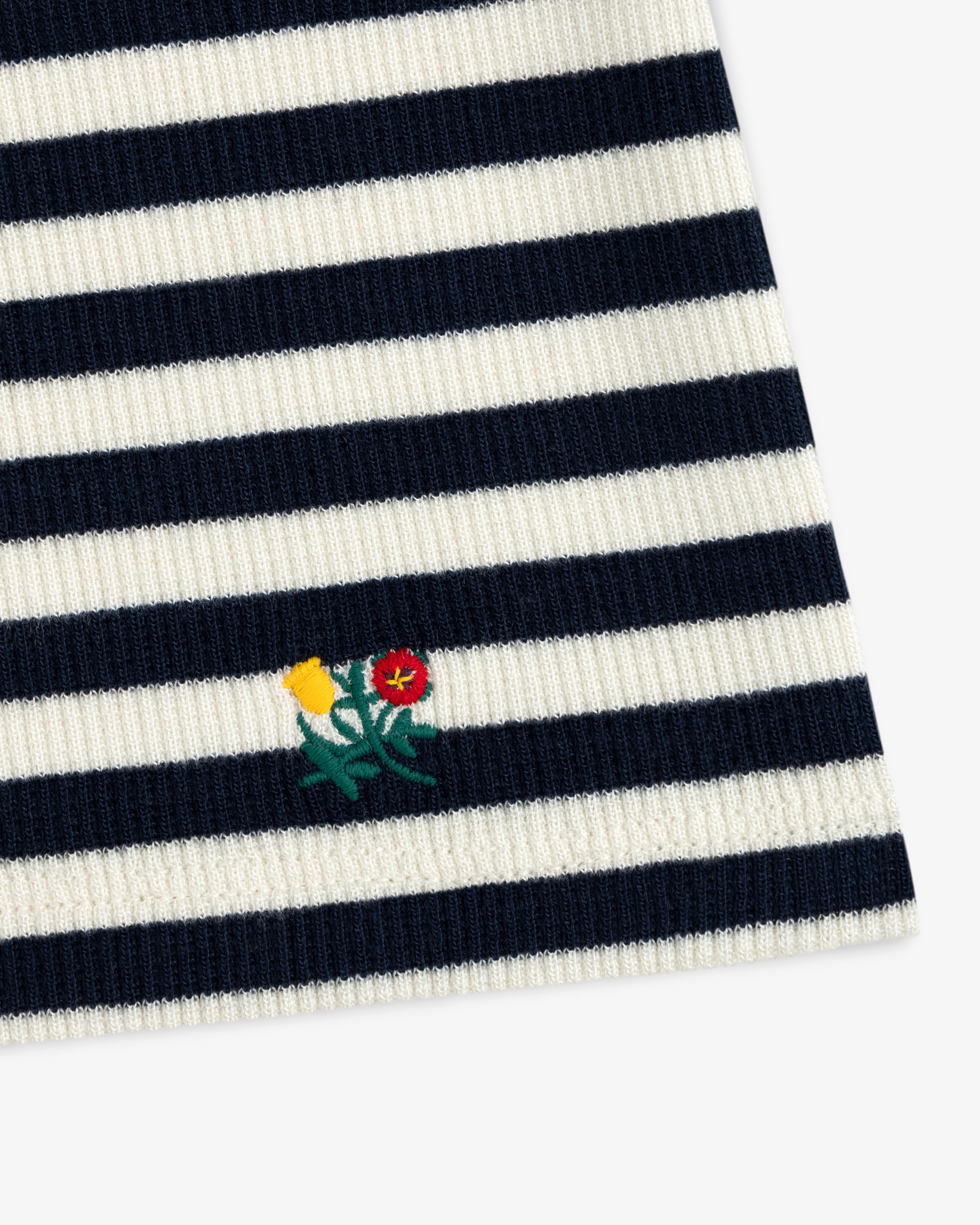 Ribbed Scoop Neck Long-Sleeve Tee in navy and white horizontal stripes with a small embroidered flower detail.