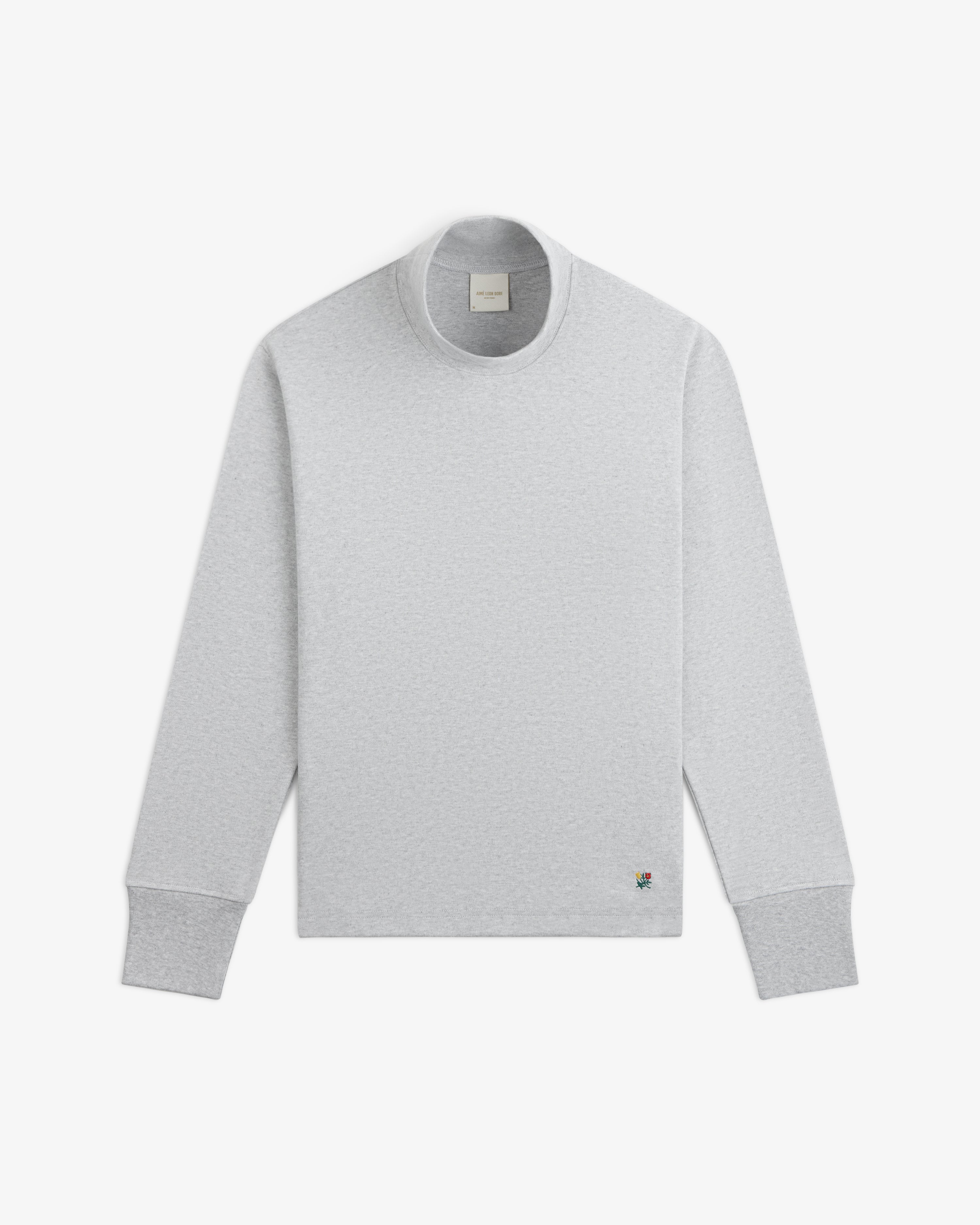 Light grey Heavyweight Crest Mockneck Tee with a small colorful crest embroidery on the lower right.