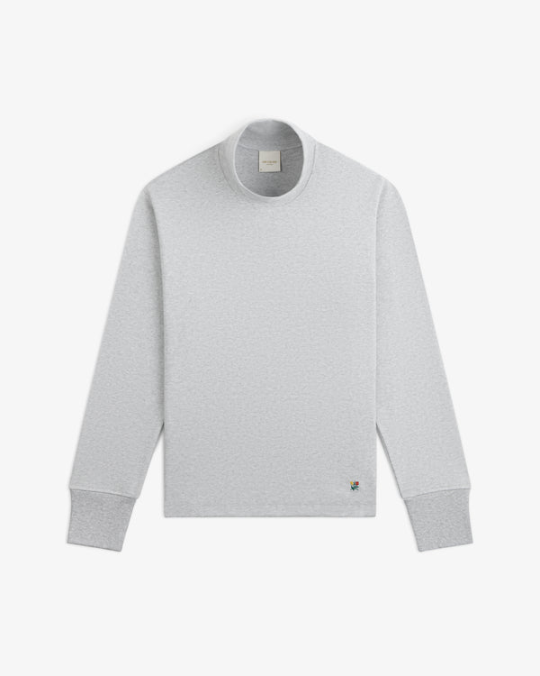 Light grey Heavyweight Crest Mockneck Tee with a small colorful crest embroidery on the lower right.