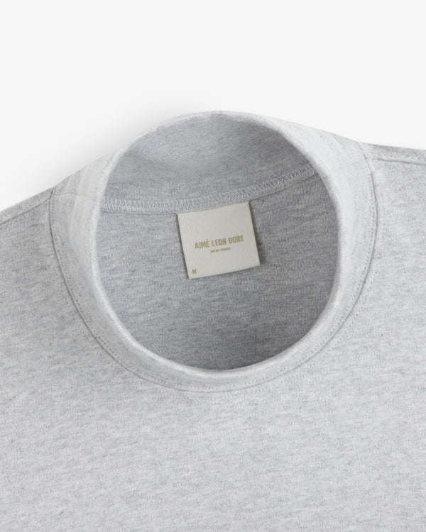 Grey Heavyweight Crest Mockneck Tee with an interior brand label at the collar.