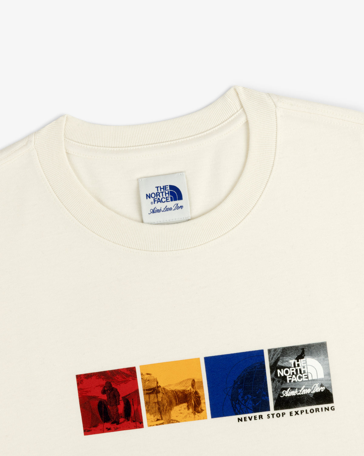 ALD / The North Face Long-Sleeve Explorer Tee in off-white with four colorful graphics and chest “Never Stop Exploring” text.