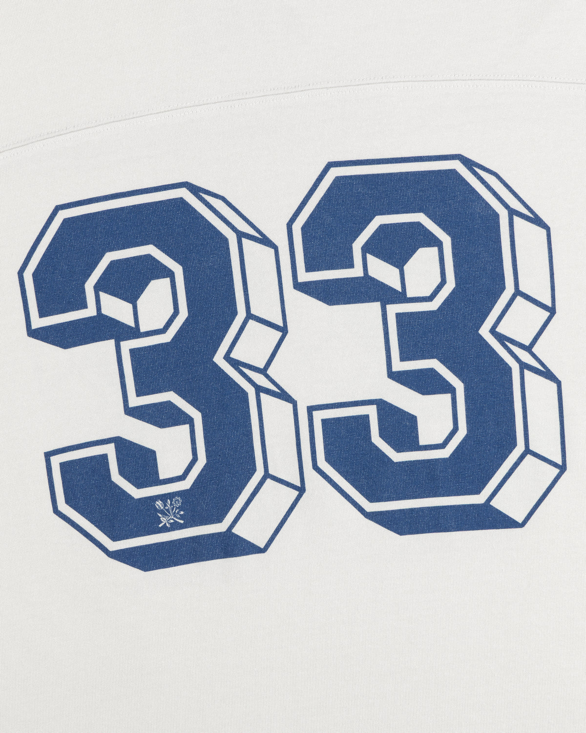 Football Ringer Tee in white fabric featuring a large blue-outlined number 33 with a small floral icon at the base.