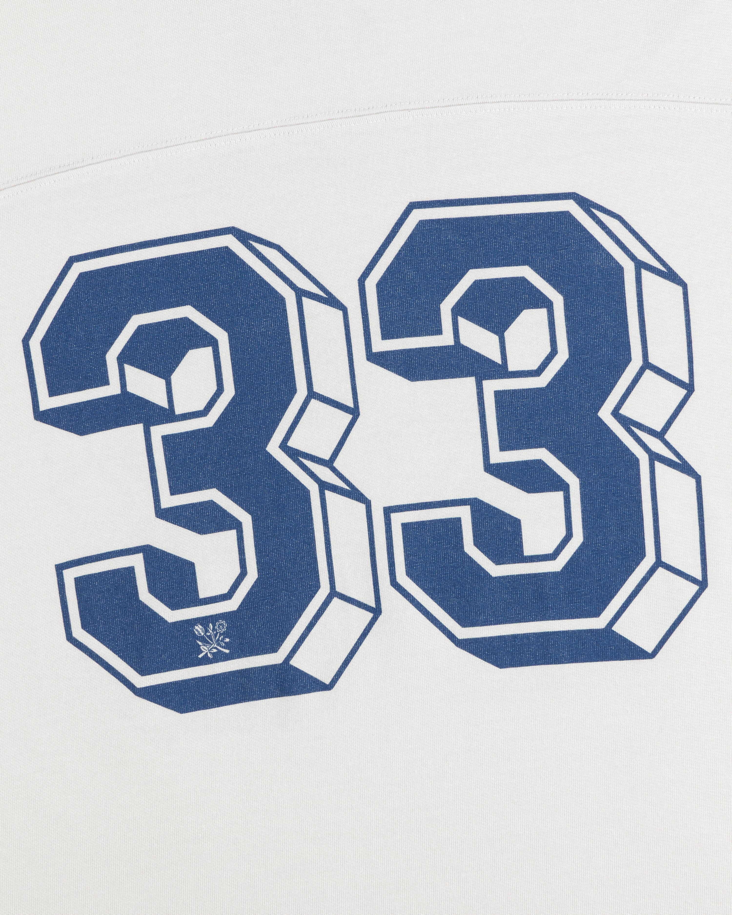 Football Ringer Tee in white fabric featuring a large blue-outlined number 33 with a small floral icon at the base.
