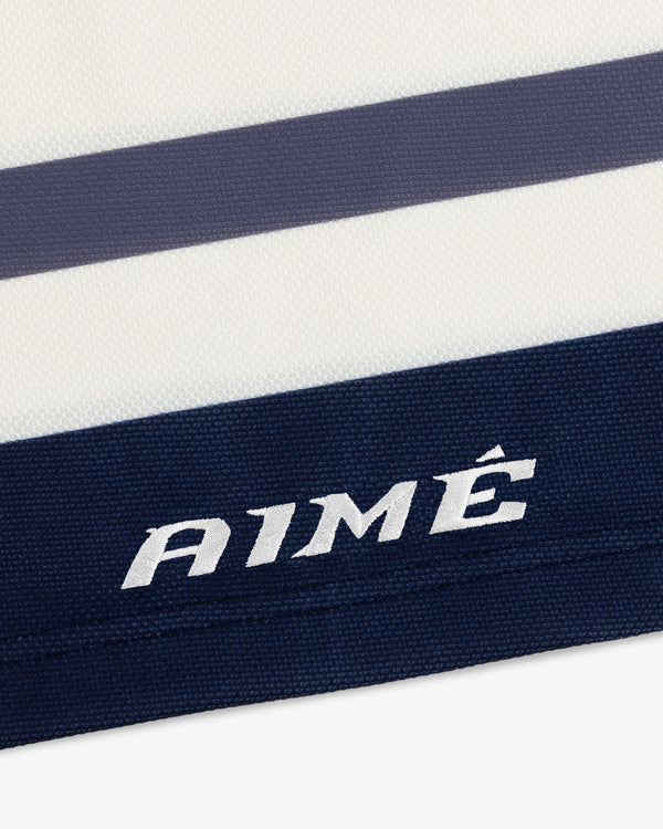 Team Aimé Hockey Jersey featuring white and navy blue stripes with the word AIMÉ embroidered on a navy stripe.