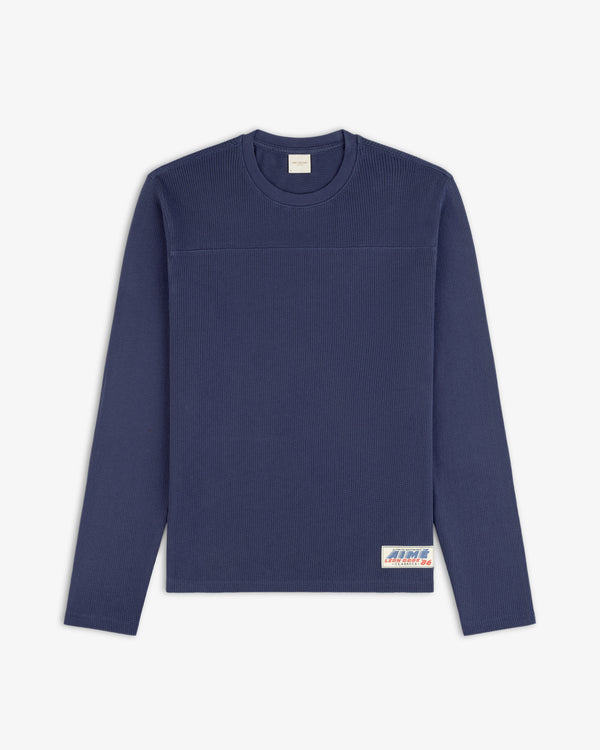 Navy Long-Sleeve Mesh Football Tee with small rectangular label on bottom right front hem.