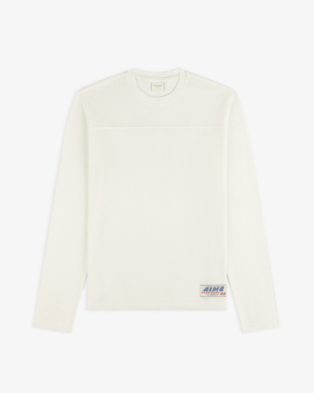 White Long-Sleeve Mesh Football Tee with a small patch near the hem, displayed on a plain background.