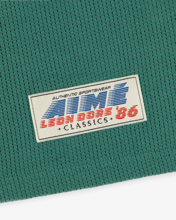 Green Long-Sleeve Mesh Football Tee with white patch: AUTHENTIC SPORTSWEAR LION BASE 86 CLASSICS in blue/red.