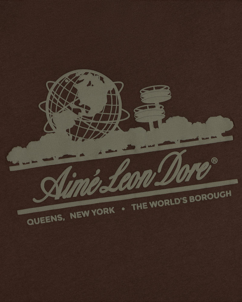 Unisphere Tee: globe, trees, and Aimé Leon Dore text—Queens, NY, The Worlds Borough on a dark background.