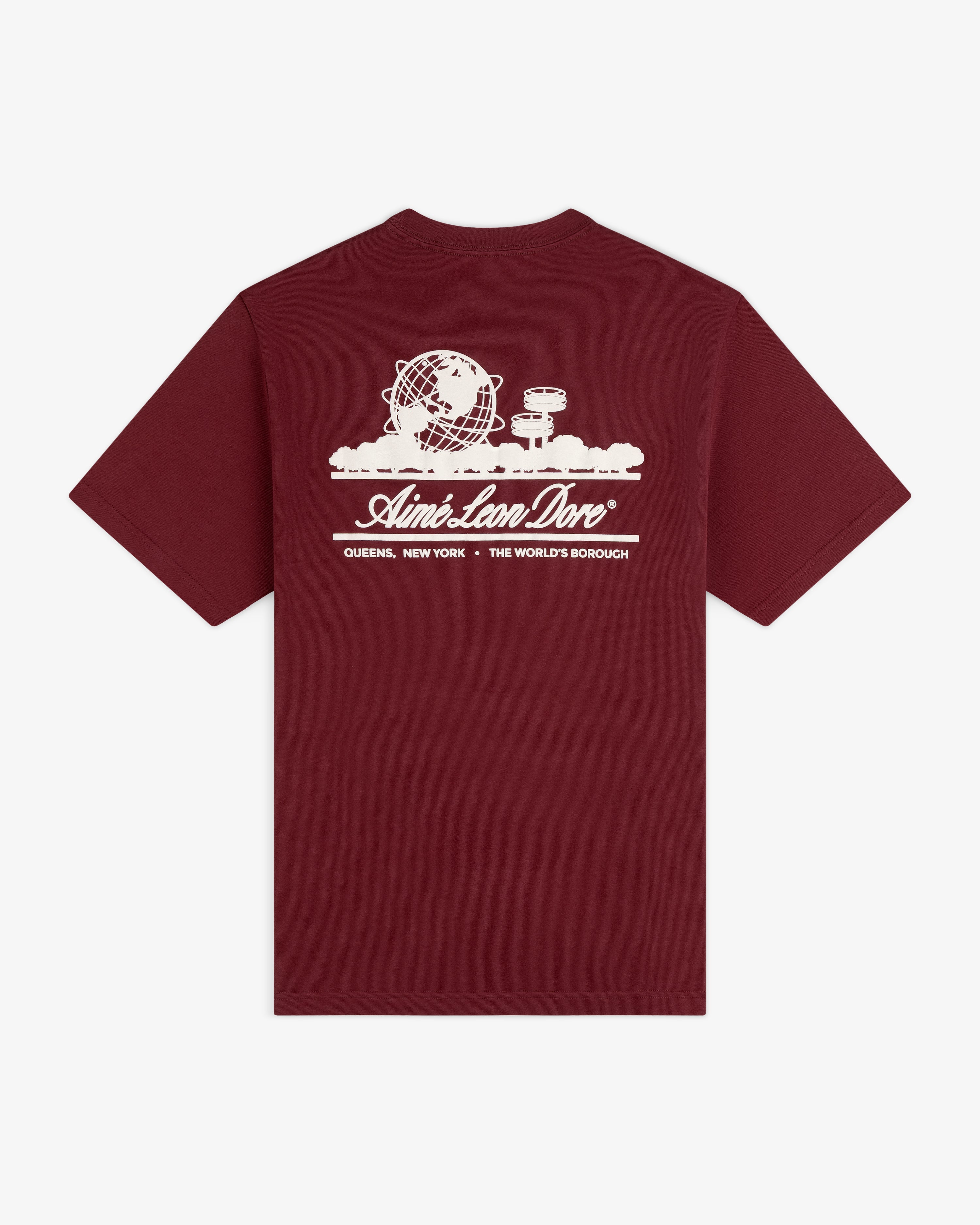 Maroon Unisphere Tee with white globe, clouds, and “Queens, New York - The World’s Borough” graphic.