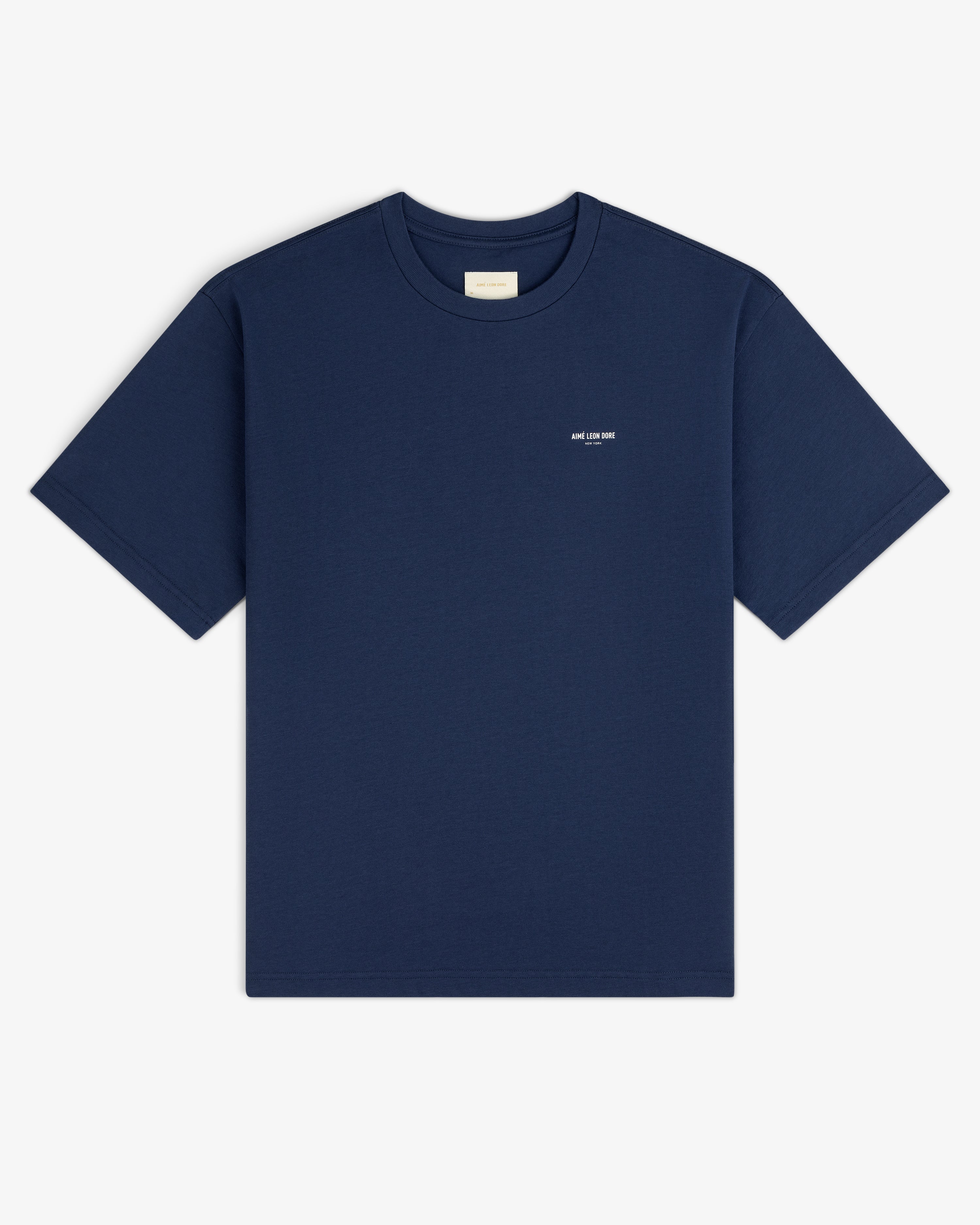 Micro Logo Tee in navy blue with a small white chest logo, displayed flat on a white background.