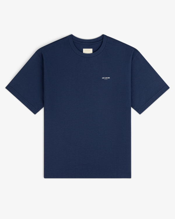 Micro Logo Tee in navy blue with a small white chest logo, displayed flat on a white background.