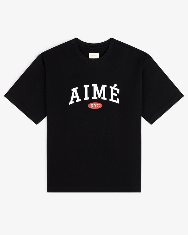 Aimé Souvenir Tee: Black tee with large white AIMÉ and small red NYC oval under the text.