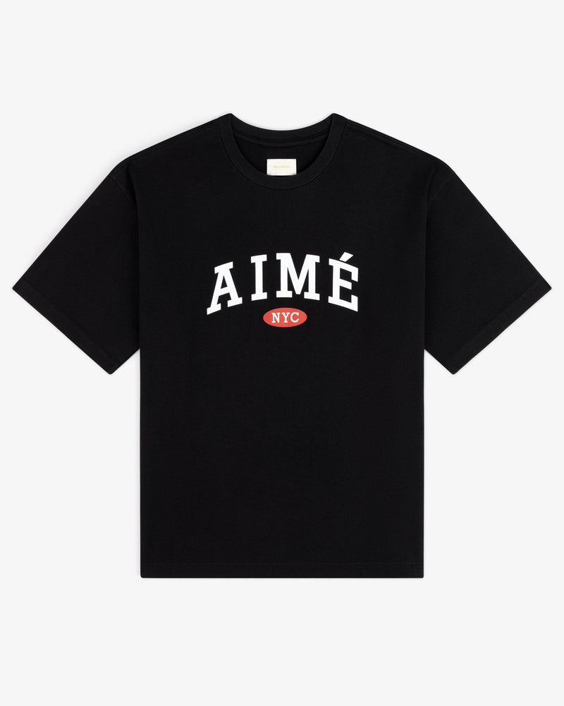 Aimé Souvenir Tee: Black tee with large white AIMÉ and small red NYC oval under the text.