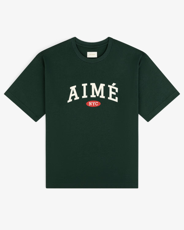 Aimé Souvenir Tee: Dark green shirt with AIMÉ in white and NYC inside a red oval on the front.