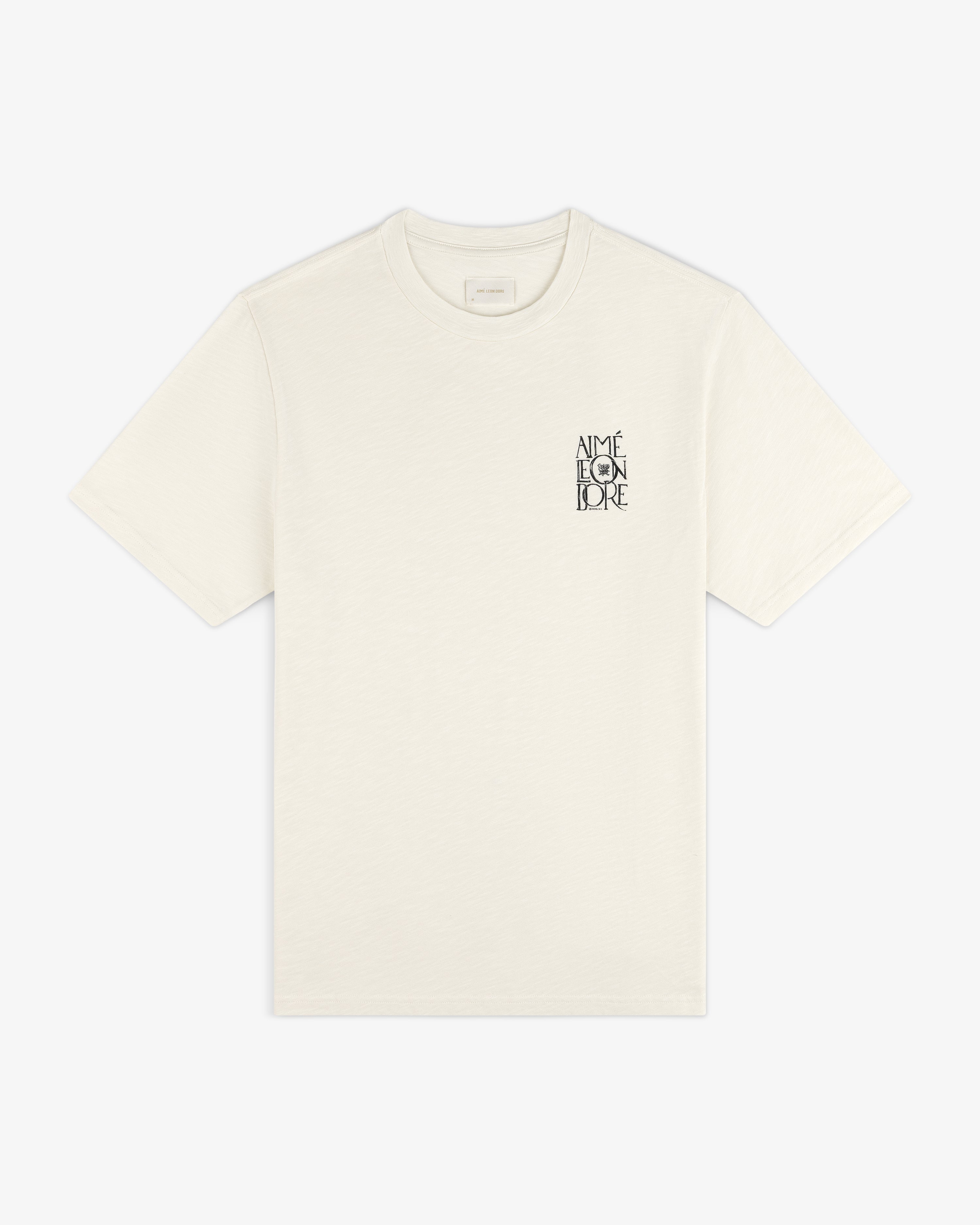 Stacked Logo Slub Tee in ivory with small black AIMÉ LEON DORE text on the left chest.