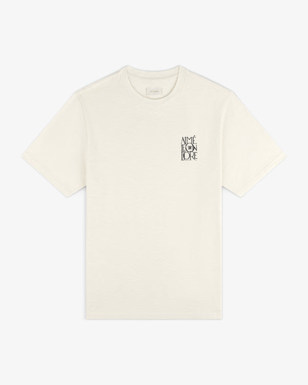 Stacked Logo Slub Tee in ivory with small black AIMÉ LEON DORE text on the left chest.