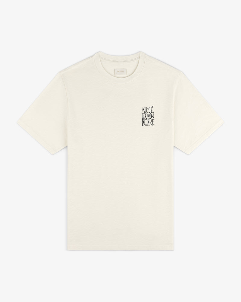 Stacked Logo Slub Tee in ivory with small black AIMÉ LEON DORE text on the left chest.