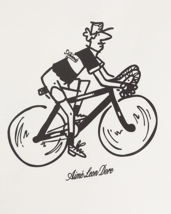 Cartoon of a cyclist with “Aimé Leon Dore” cursive logo, featured on the Aimé Tour Graphic Tee.