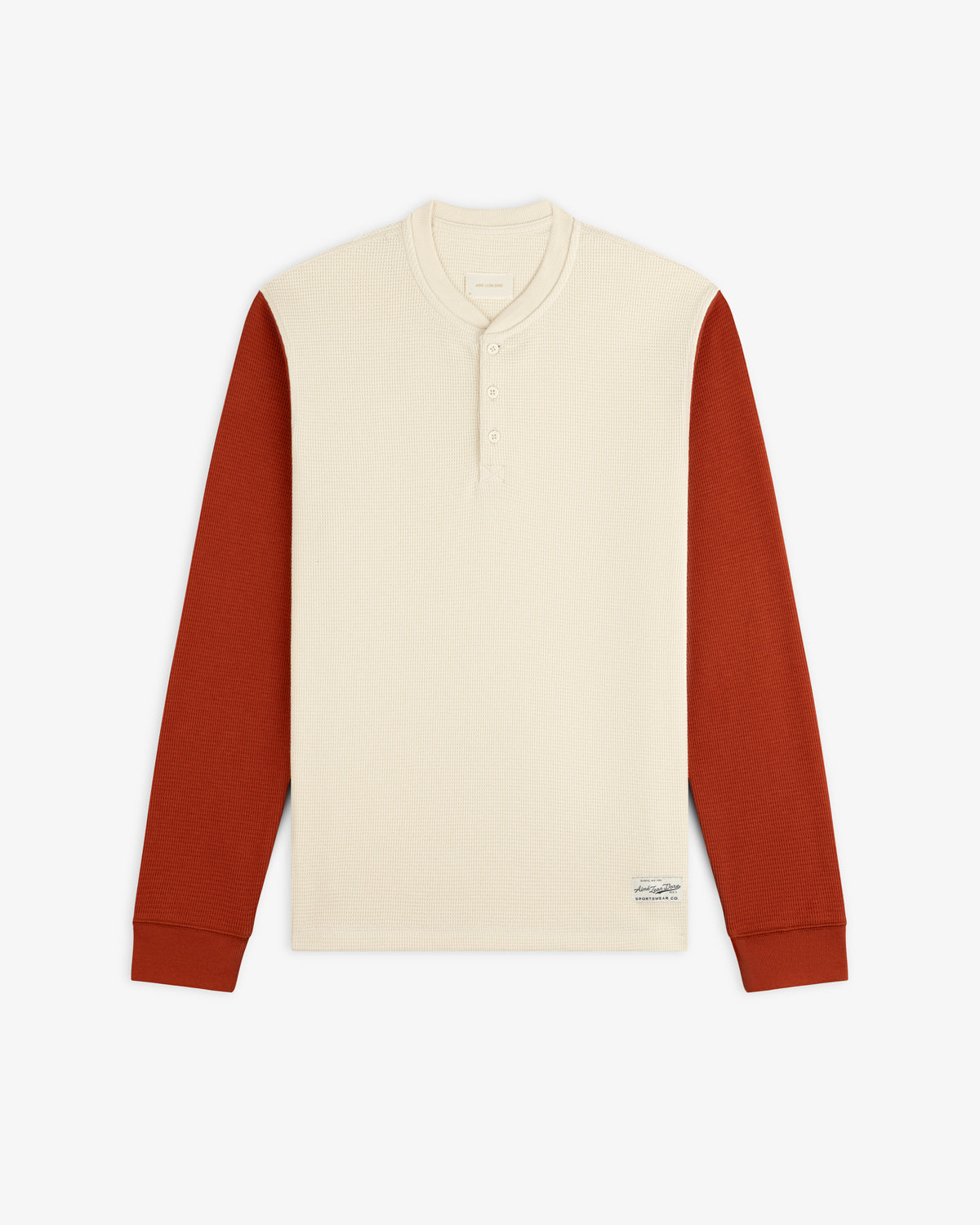 Cream-colored Long-Sleeve Waffle Henley with rust-colored sleeves.