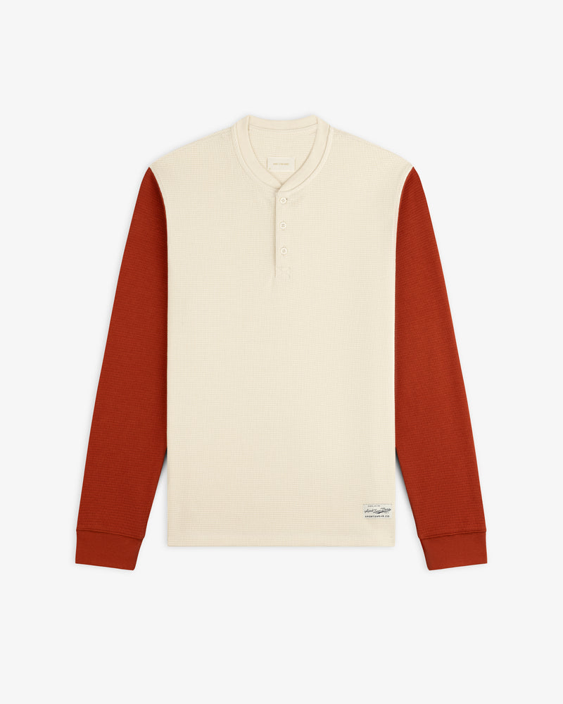 Cream-colored Long-Sleeve Waffle Henley with rust-colored sleeves.