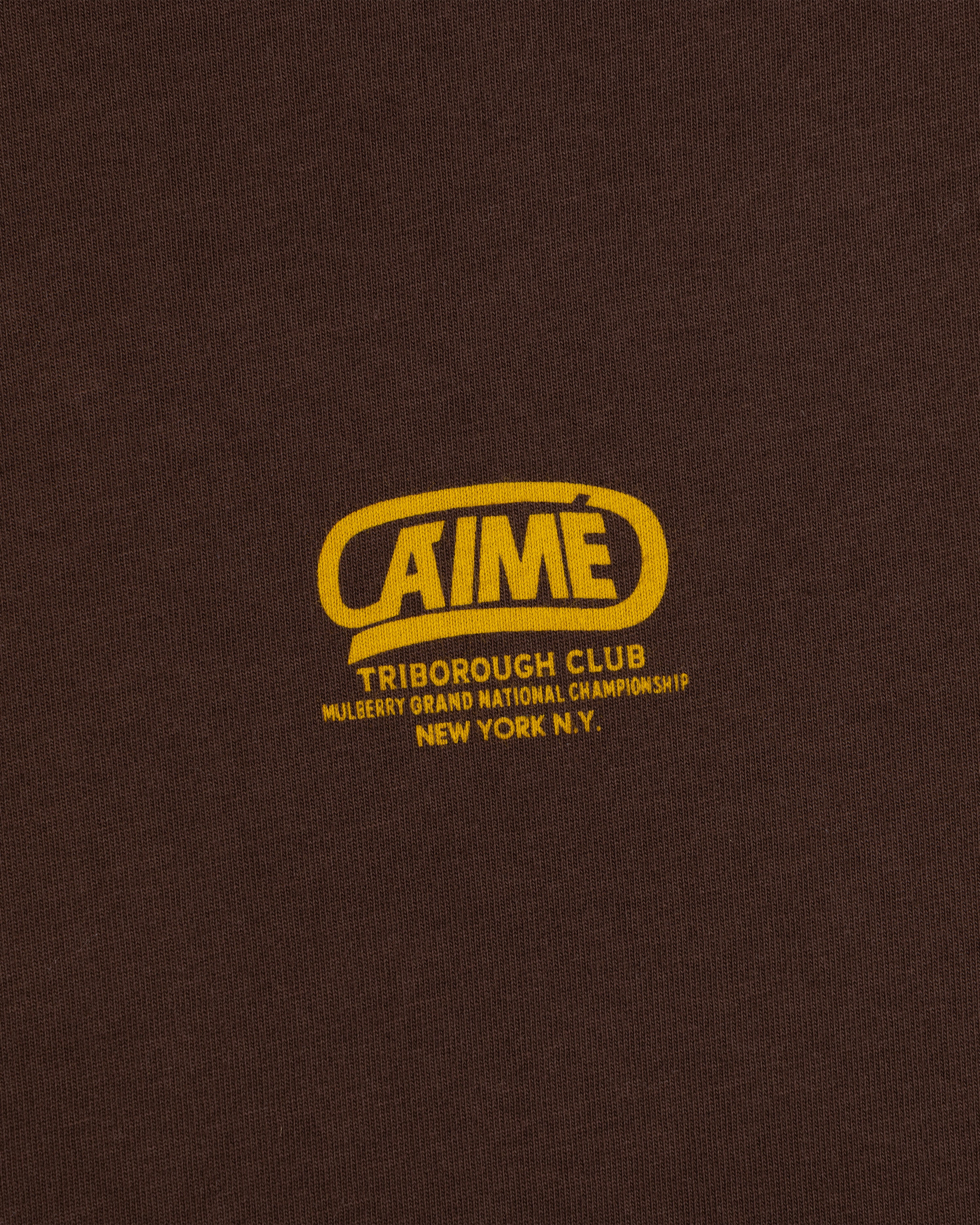 Brown Triborough Club Tee with a yellow logo reading AIME, Triborough Club, Mulberry Grand National Championship, New York.