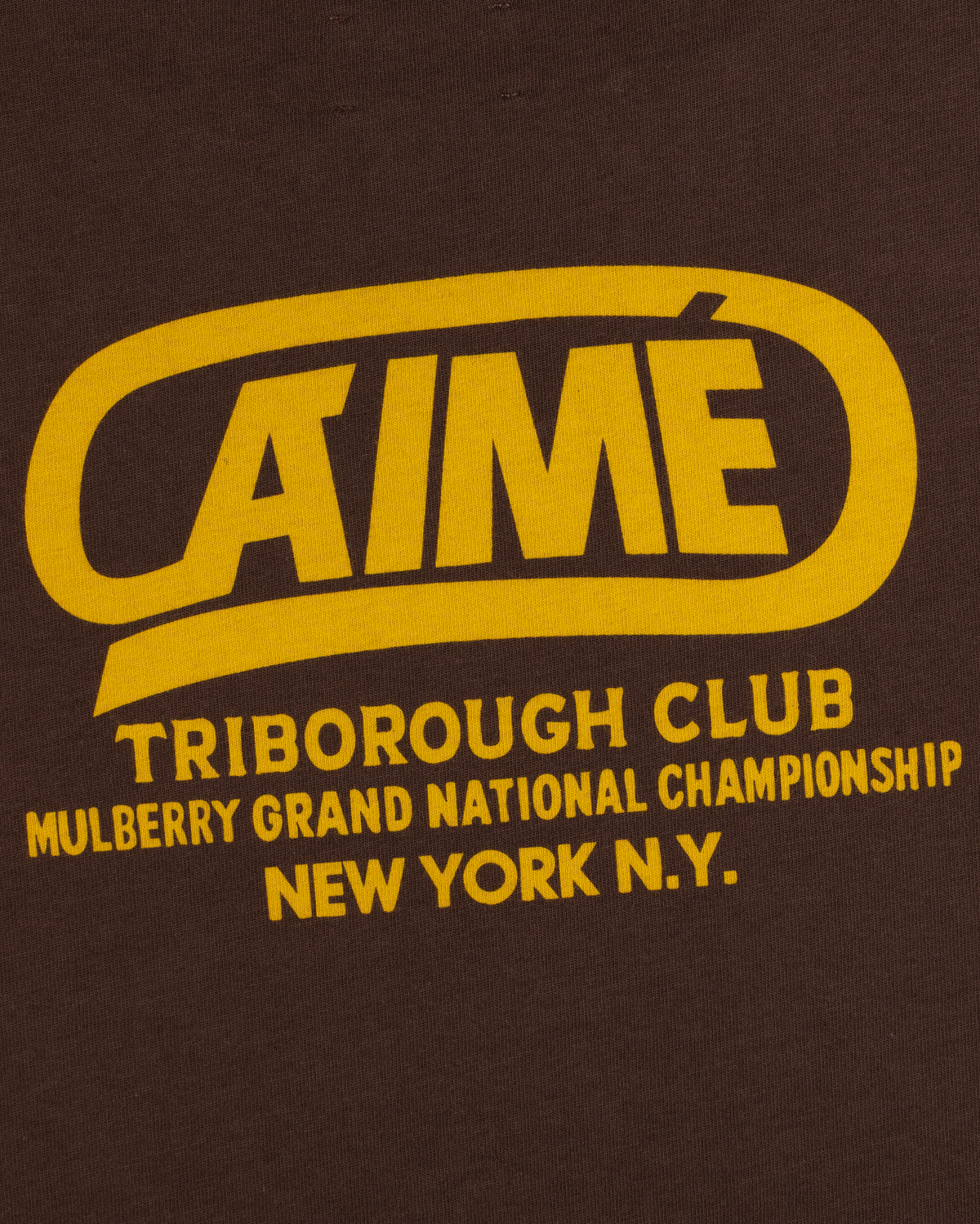 Brown Triborough Club Tee with yellow text reading Aime, Triborough Club, Mulberry Grand National Championship, and N.Y.