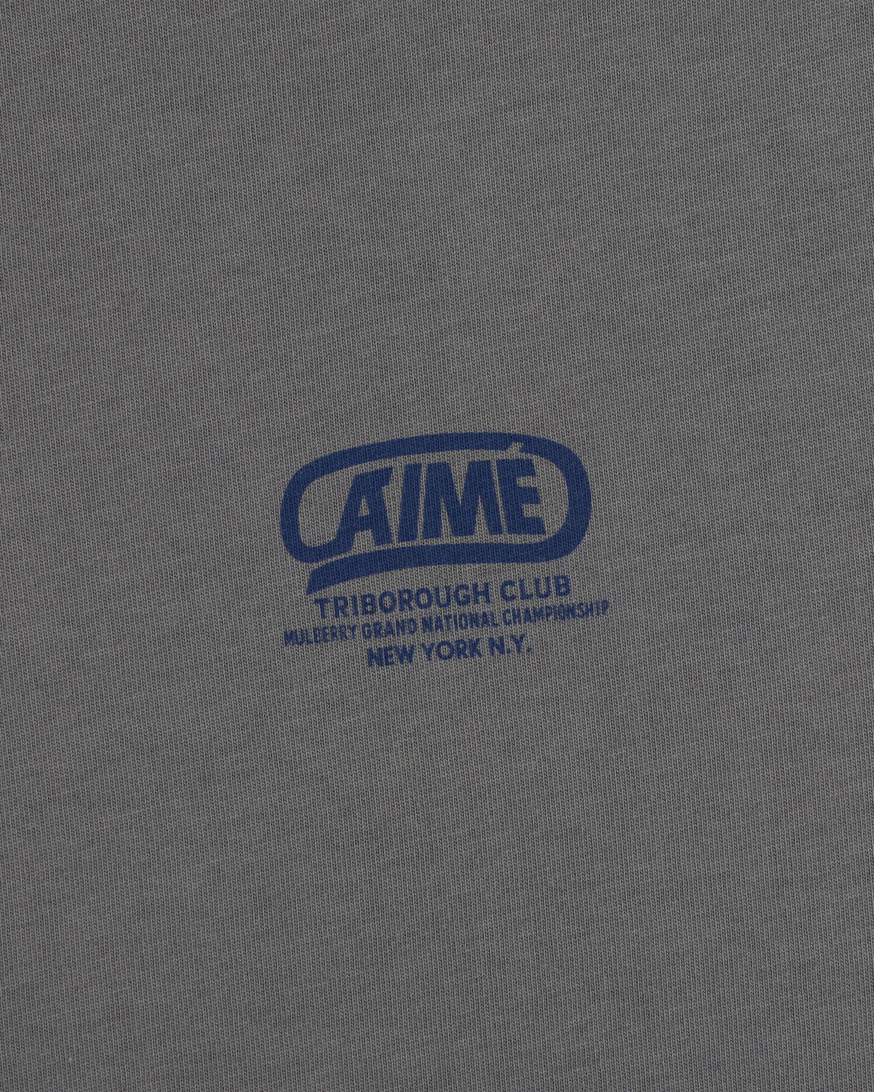 Gray Triborough Club Tee with a blue graphic logo reading Aime Triborough Club Mulberry Grand National Championship N.Y.