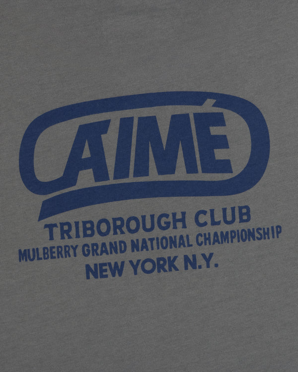 Dark grey Triborough Club Tee with blue text reading AIME TRIBOROUGH CLUB MULBERRY GRAND NATIONAL CHAMPIONSHIP NEW YORK N.Y.