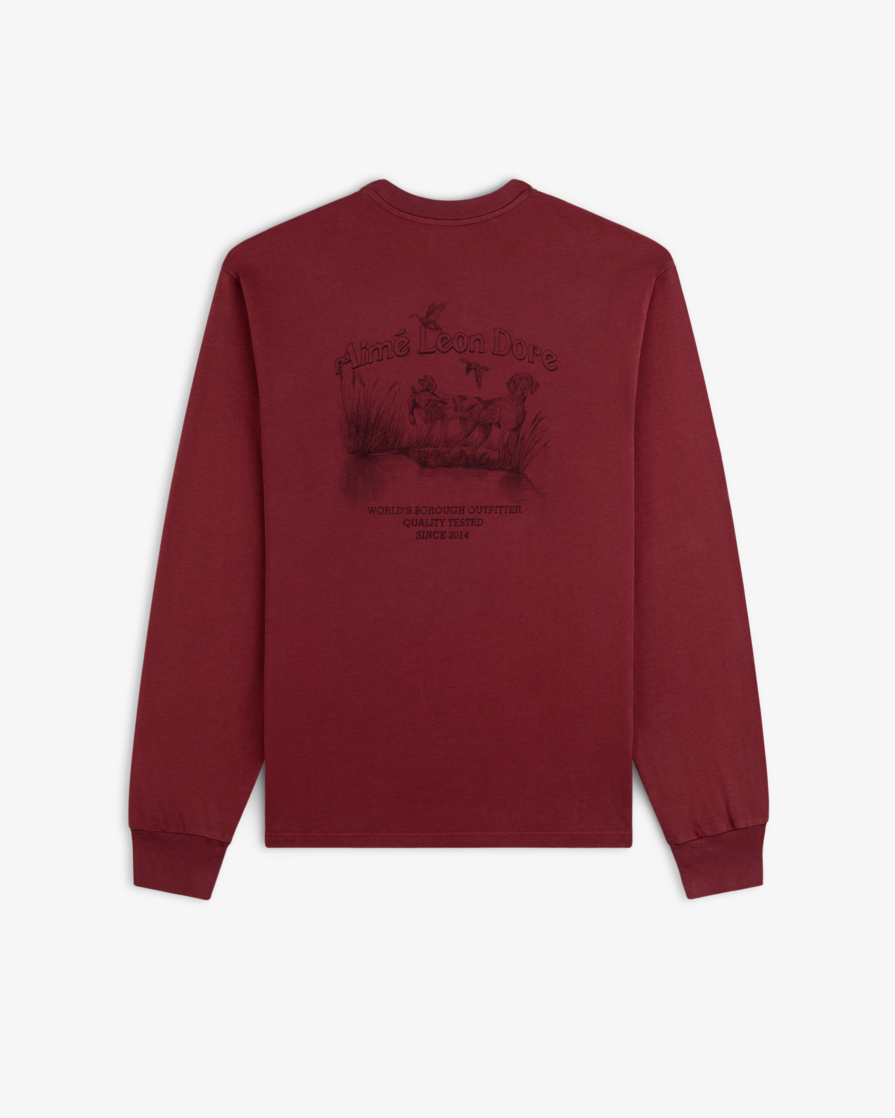 Maroon Long-Sleeve Retriever Tee featuring a back graphic of a dog in a marsh with text.