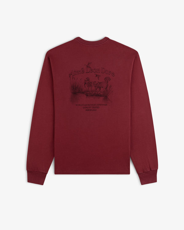 Maroon Long-Sleeve Retriever Tee featuring a back graphic of a dog in a marsh with text.