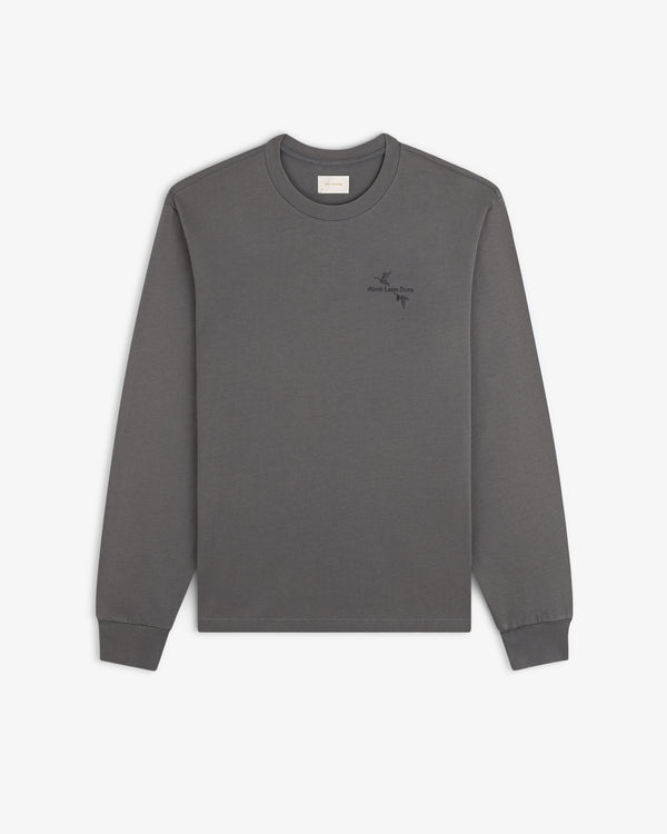 Charcoal grey long-sleeve Long-Sleeve Retriever Tee featuring two small bird illustrations and text on the left chest.
