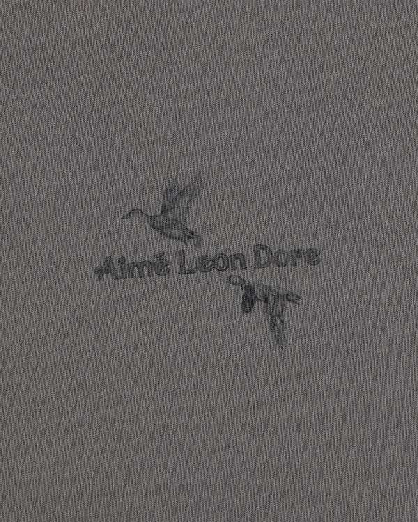 Long-Sleeve Retriever Tee in grey with a graphic of two flying ducks and the text Aimé Leon Dore.