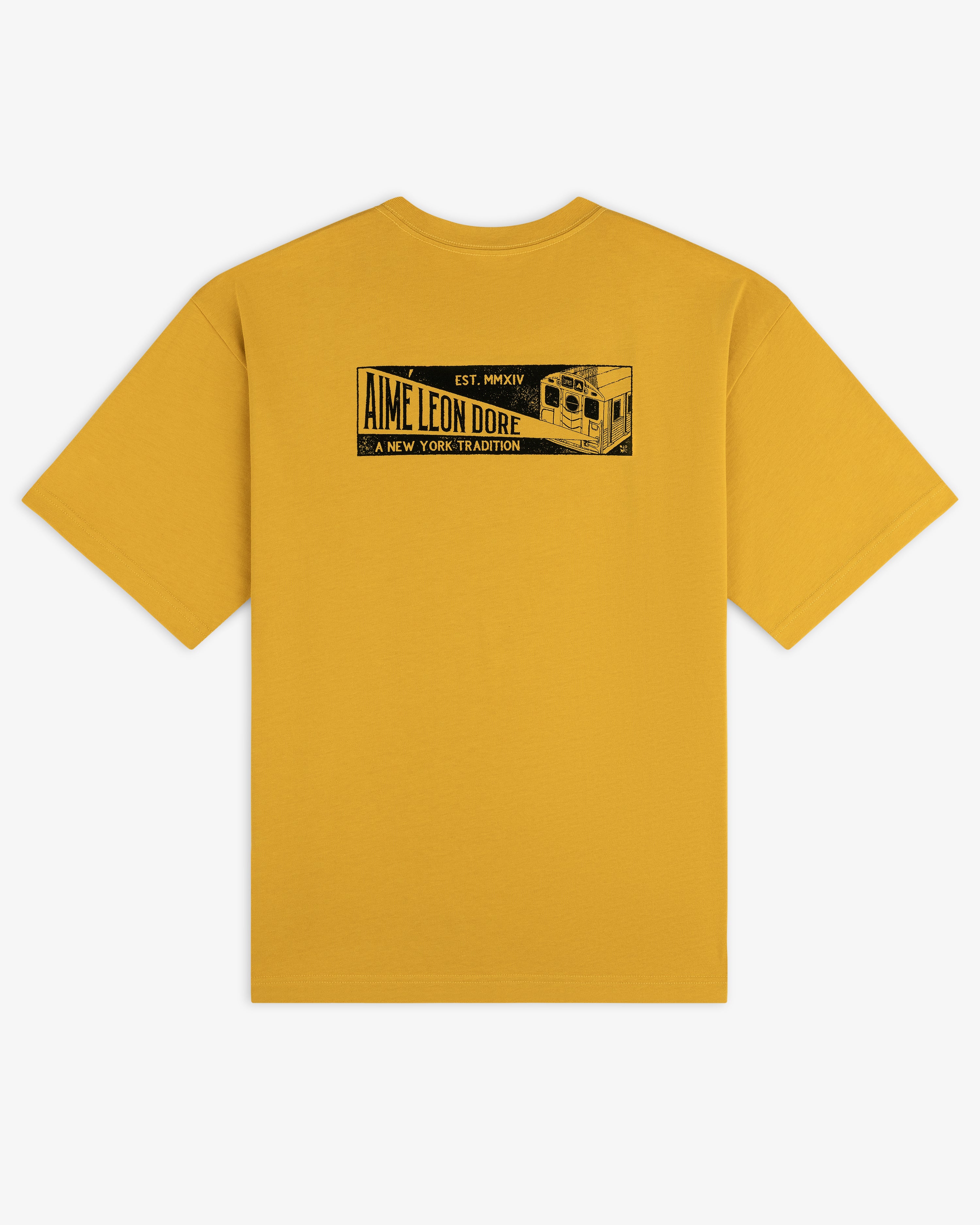 Mustard yellow Aimé Transit Tee featuring a black rectangular graphic of a New York subway train and text on the back.